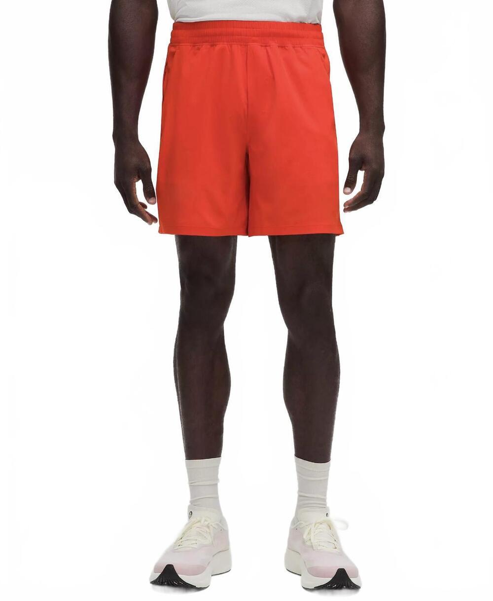 NEW LULULEMON men's pace breaker short in solar orange